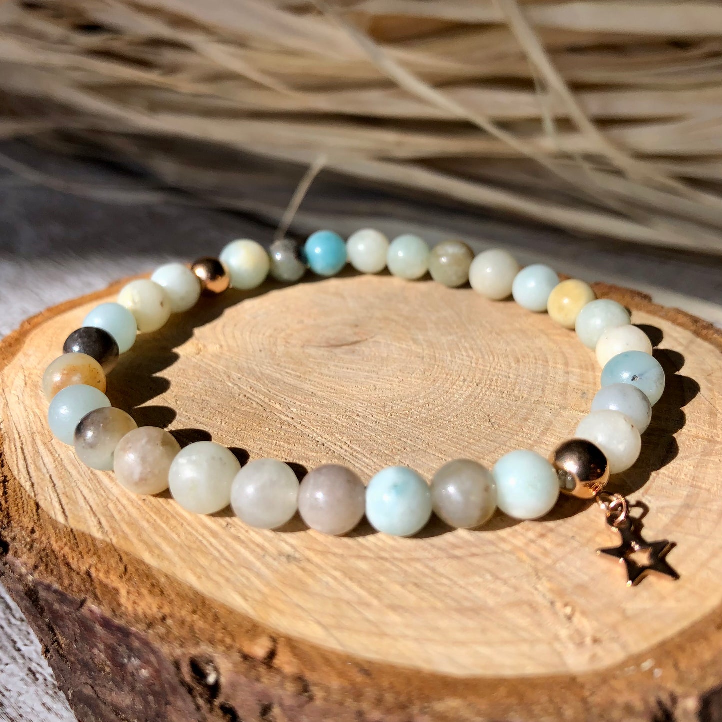 A multicolored amazonite beaded bracelet with rose gold stainless steel accents. Handmade with natural beads