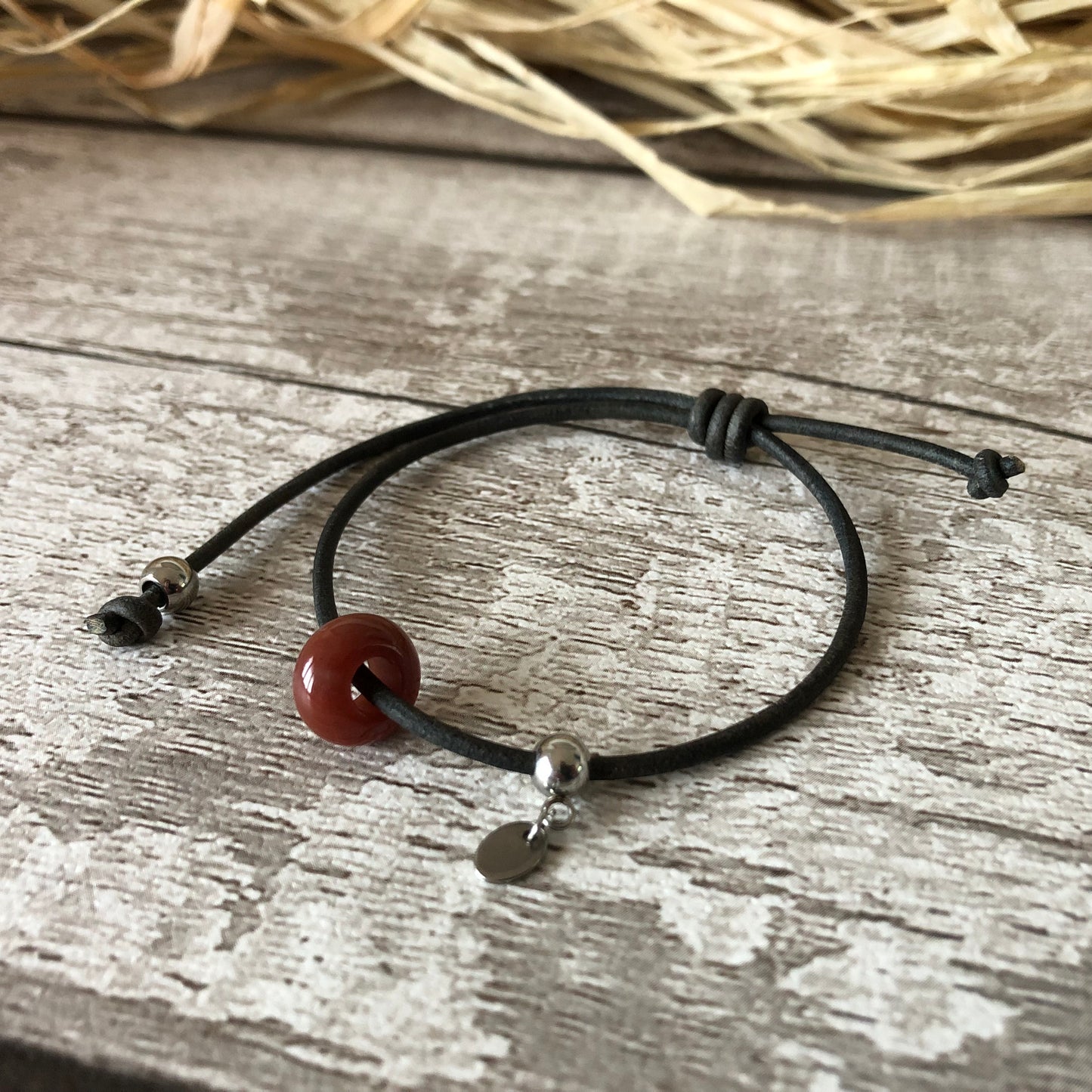 Red Indian Agate on leather cord bracelet