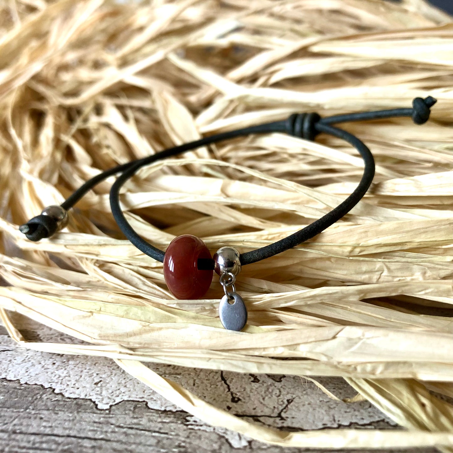 Red Indian Agate on leather cord bracelet