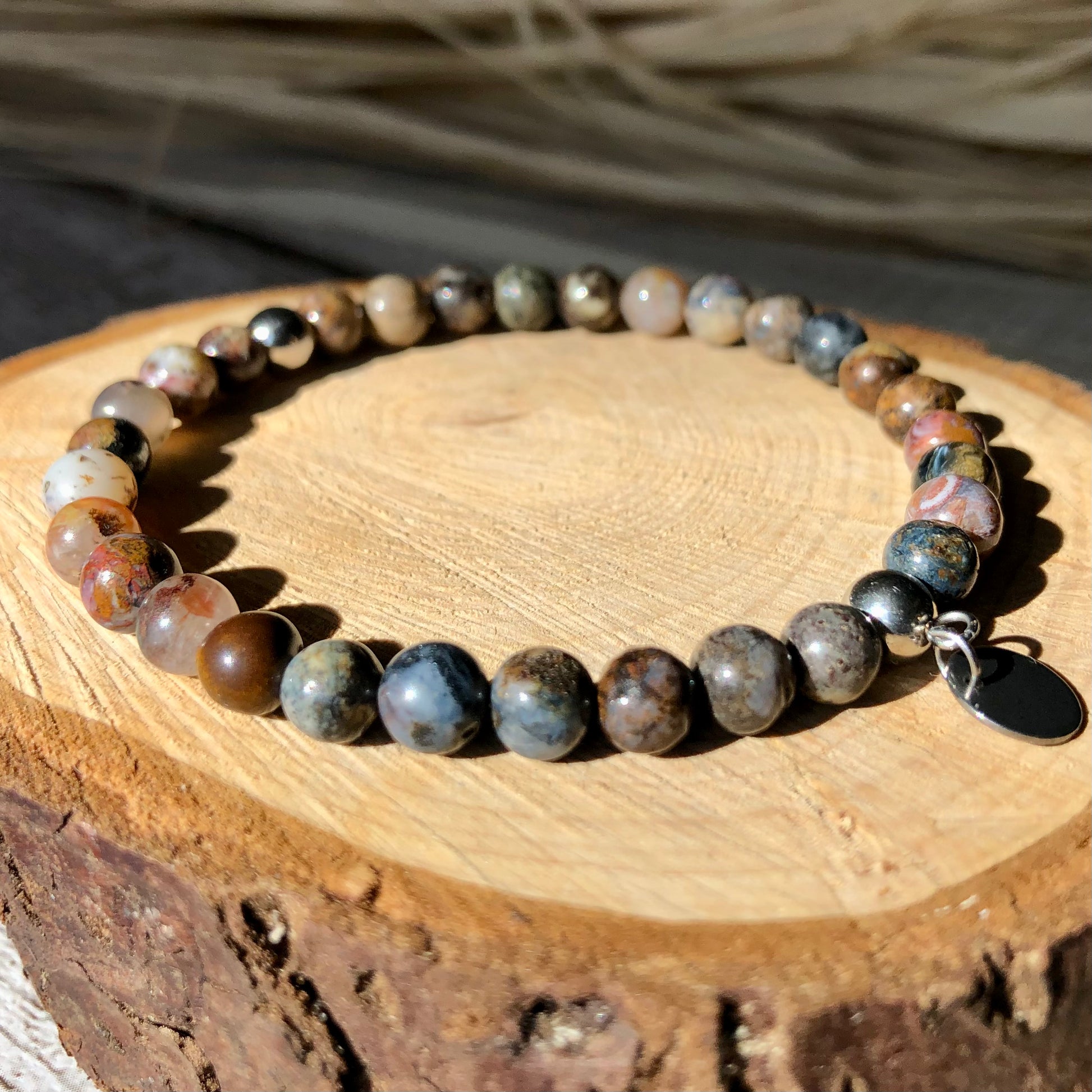 A multicolored pietersite beaded bracelet handmade with natural pietersite beads